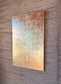 a piece of art hanging on a wall